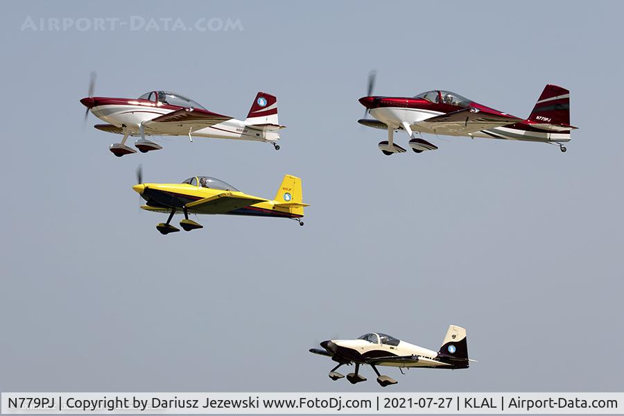 N779PJ, 2018 Vans RV-7 C/N 70672, RV airplanes taking off for large formation flight over Oshkosh grounds