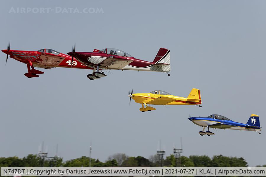 N747DT, 2014 Vans RV-8 C/N 82862, RV airplanes taking off for large formation flight over Oshkosh grounds