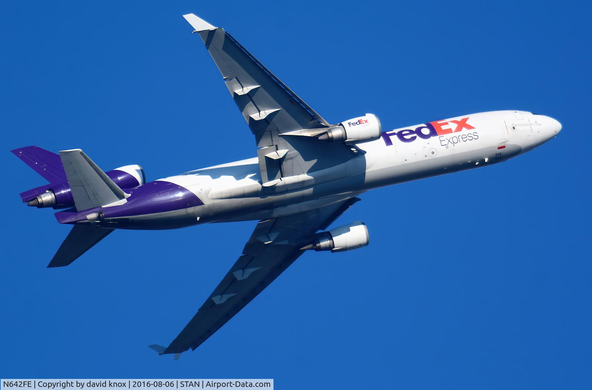 N642FE, 1992 McDonnell Douglas MD-11F C/N 48485, md11 fed ex cargo tramper leaving stansted in sky over bishops stortford a few years back i love the md-11 a great plane