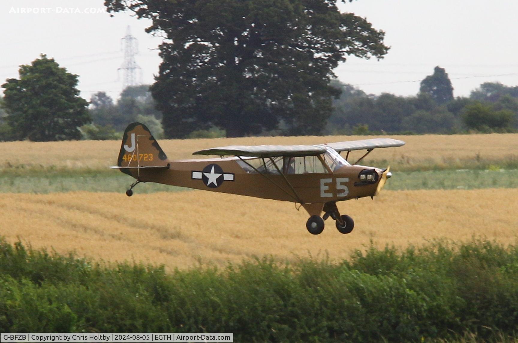 G-BFZB, 1947 Piper L-4J Grasshopper (J3C-65D) C/N 13019, Welcome visitor landing at Old Warden, Beds.