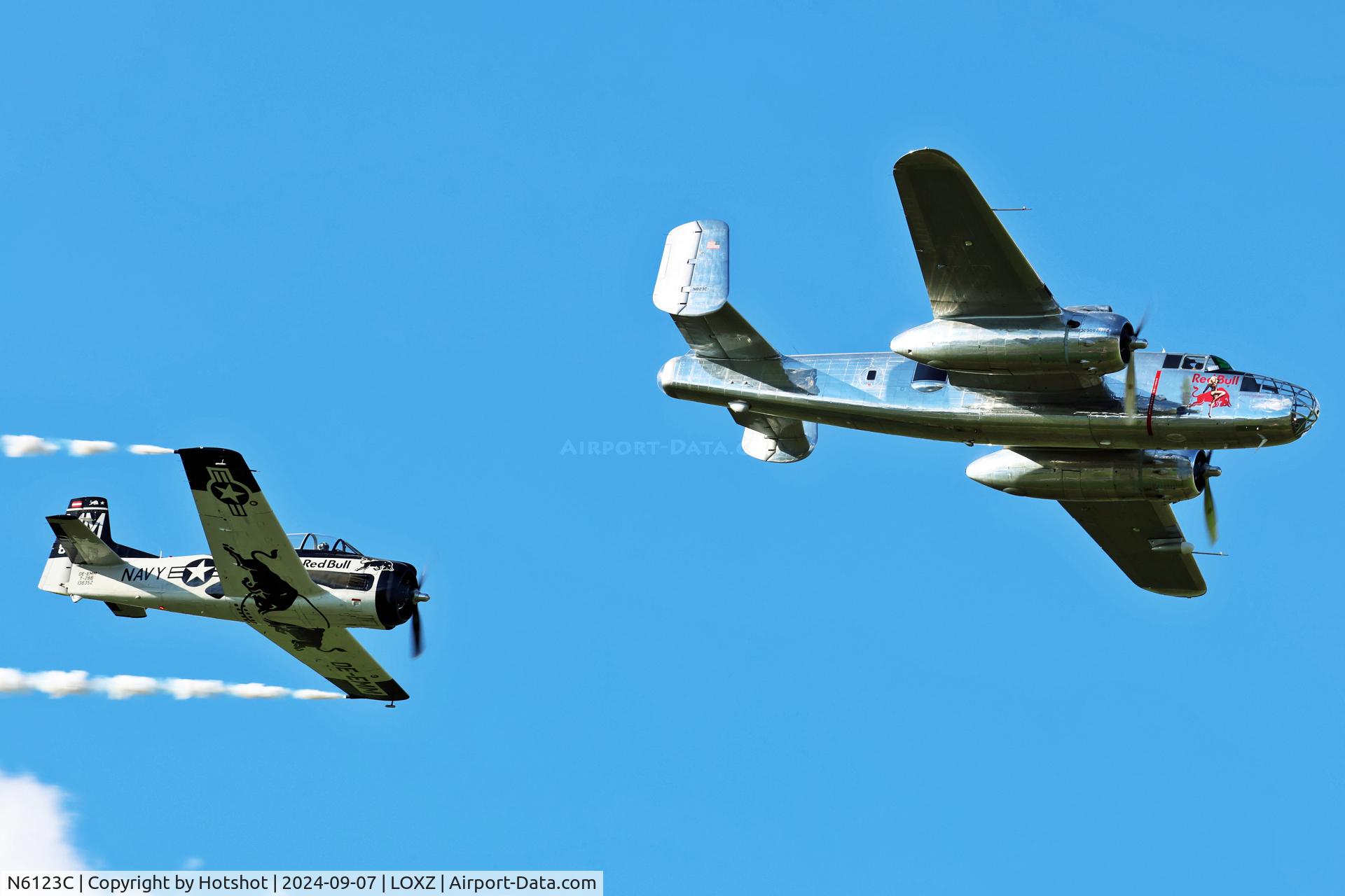 N6123C, 1945 North American B-25J-30-NC Mitchell Mitchell C/N 108-47647, Formation pass with T-28 OE-EMM