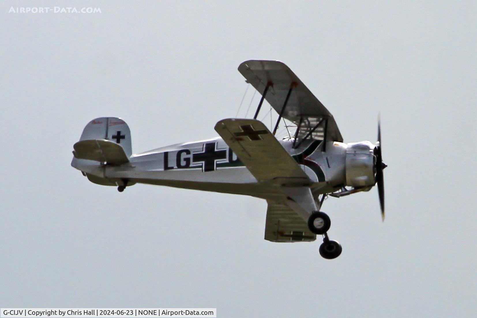 G-CIJV, 1940 CASA 1-133 Jungmeister C/N 35, over Oulton Park race course