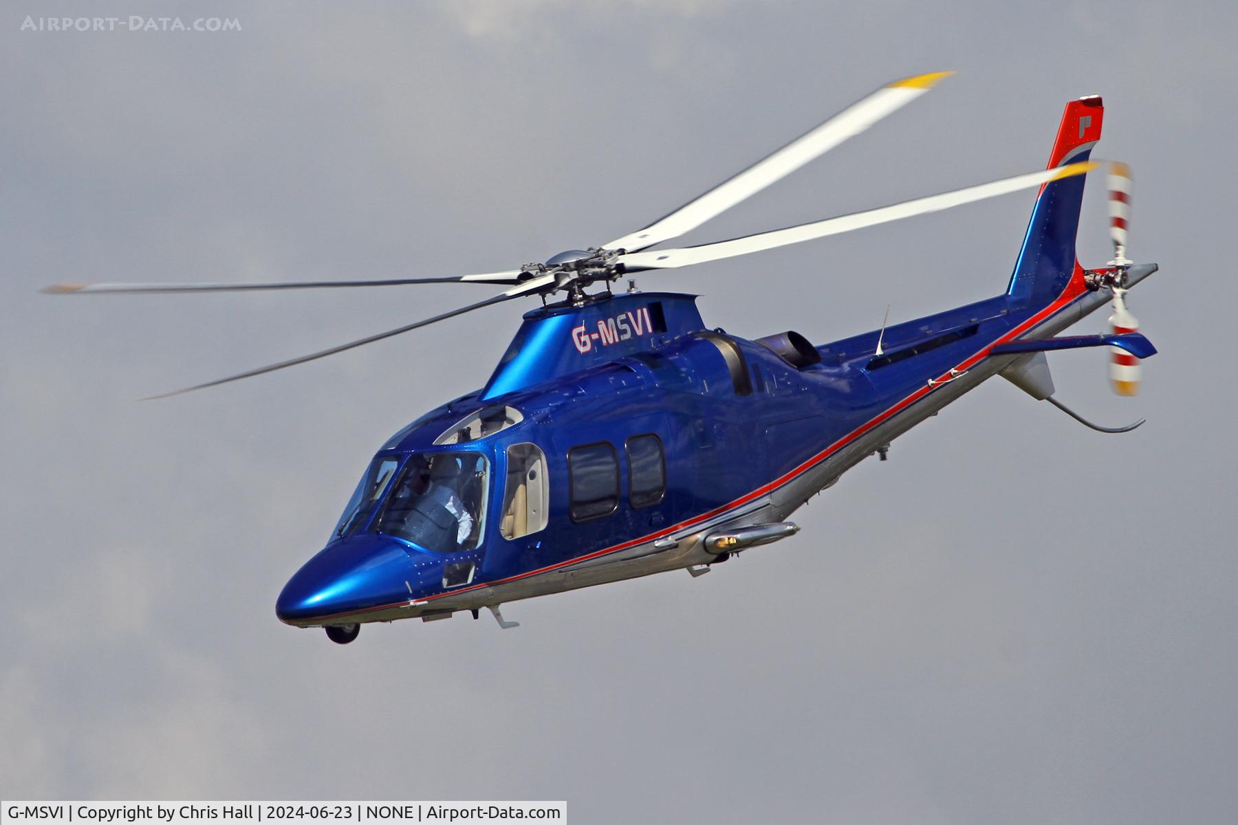 G-MSVI, 2006 Agusta A-109S Grand C/N 22028, over Oulton Park race course