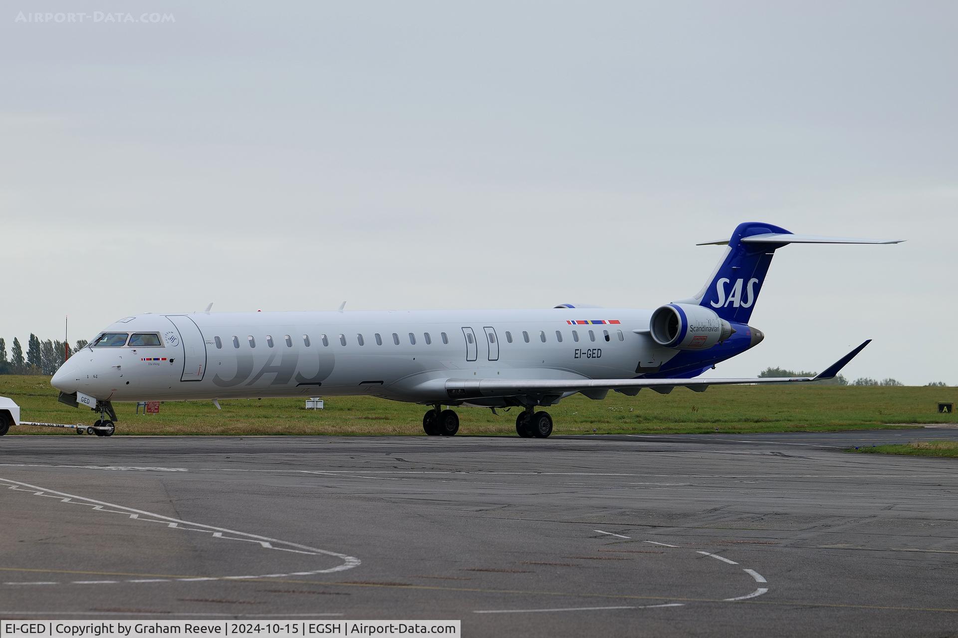EI-GED, 2009 Bombardier CRJ-900 (CL-600-2D24) C/N 15240, Under tow at Norwich after a re-spray.