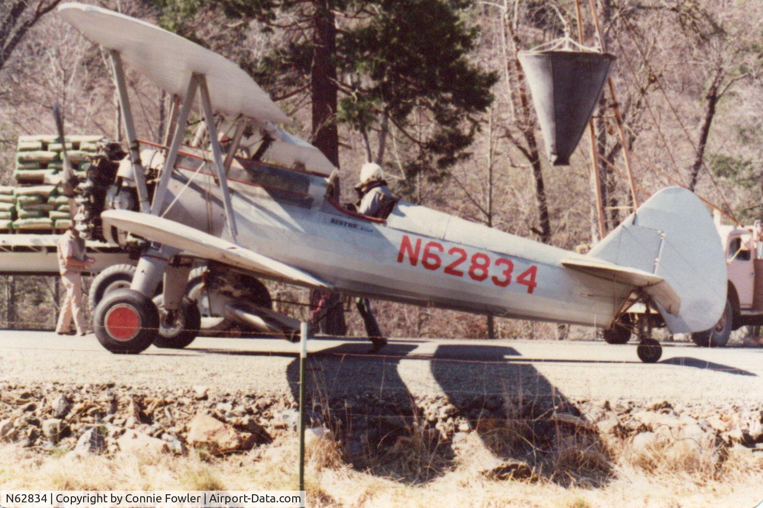 N62834, 1940 Boeing A75N1(PT17) C/N 75-533, Mid 70's Crop-dusting in the little Applegate valley of Southern Oregon near historical Buncom. Of course using the road as a runway.
