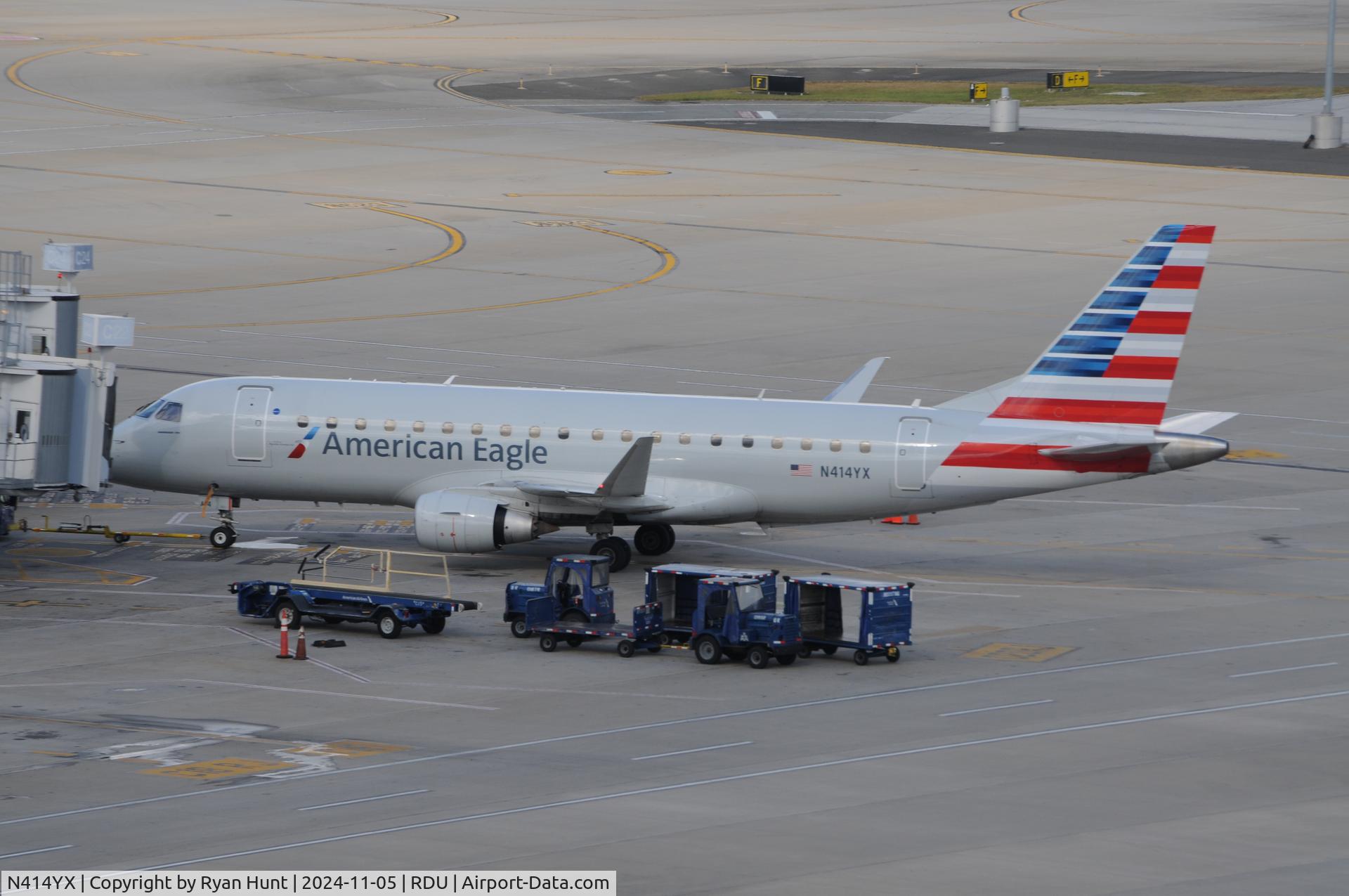 N414YX, 2013 Embraer 175LR (ERJ-170-200LR) C/N 17000377, A Brickyard at a gate.