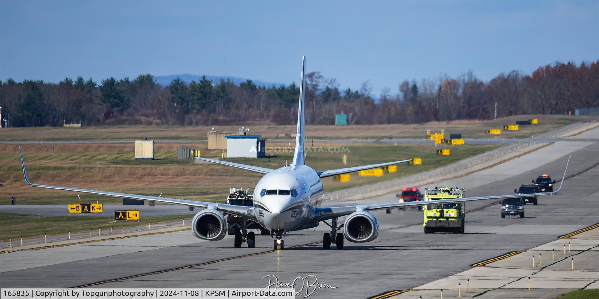 165835, 2004 Boeing C-40A Clipper C/N 33826, Airport Fire department follows CONVOY4356 to the ramp with its right engine shut down.