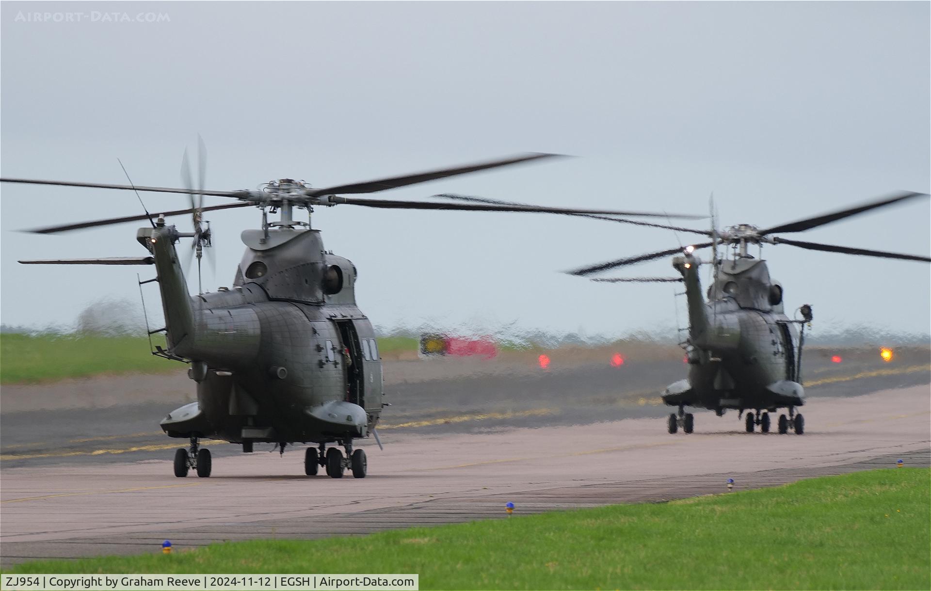 ZJ954, Westland Puma HC.2 C/N 1310, XW220 leading ZJ954 to depart from runway 09 at Norwich.