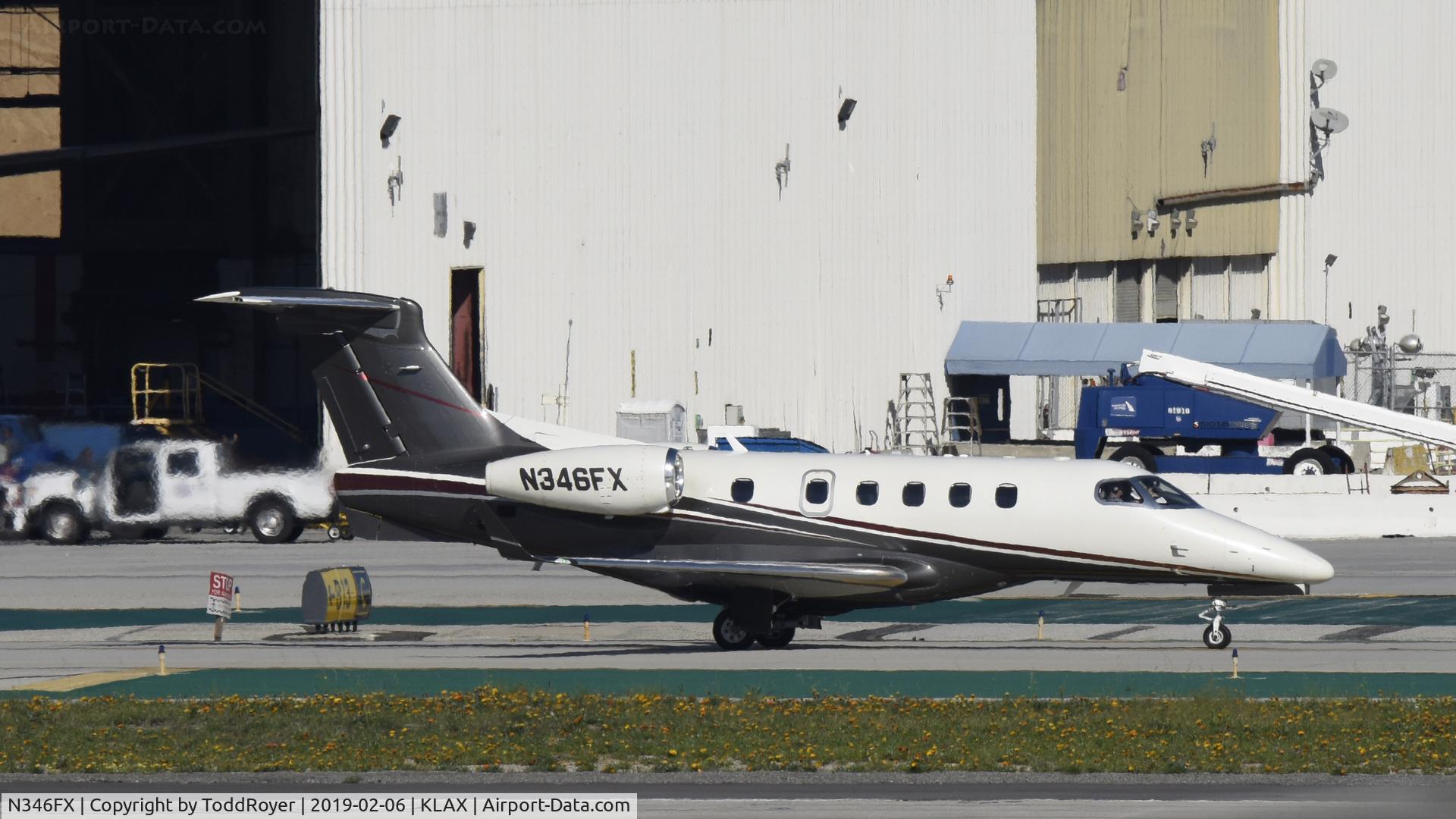 N346FX, 2012 Embraer EMB-505 Phenom 300 C/N 50500090, Taxiing to parking at LAX