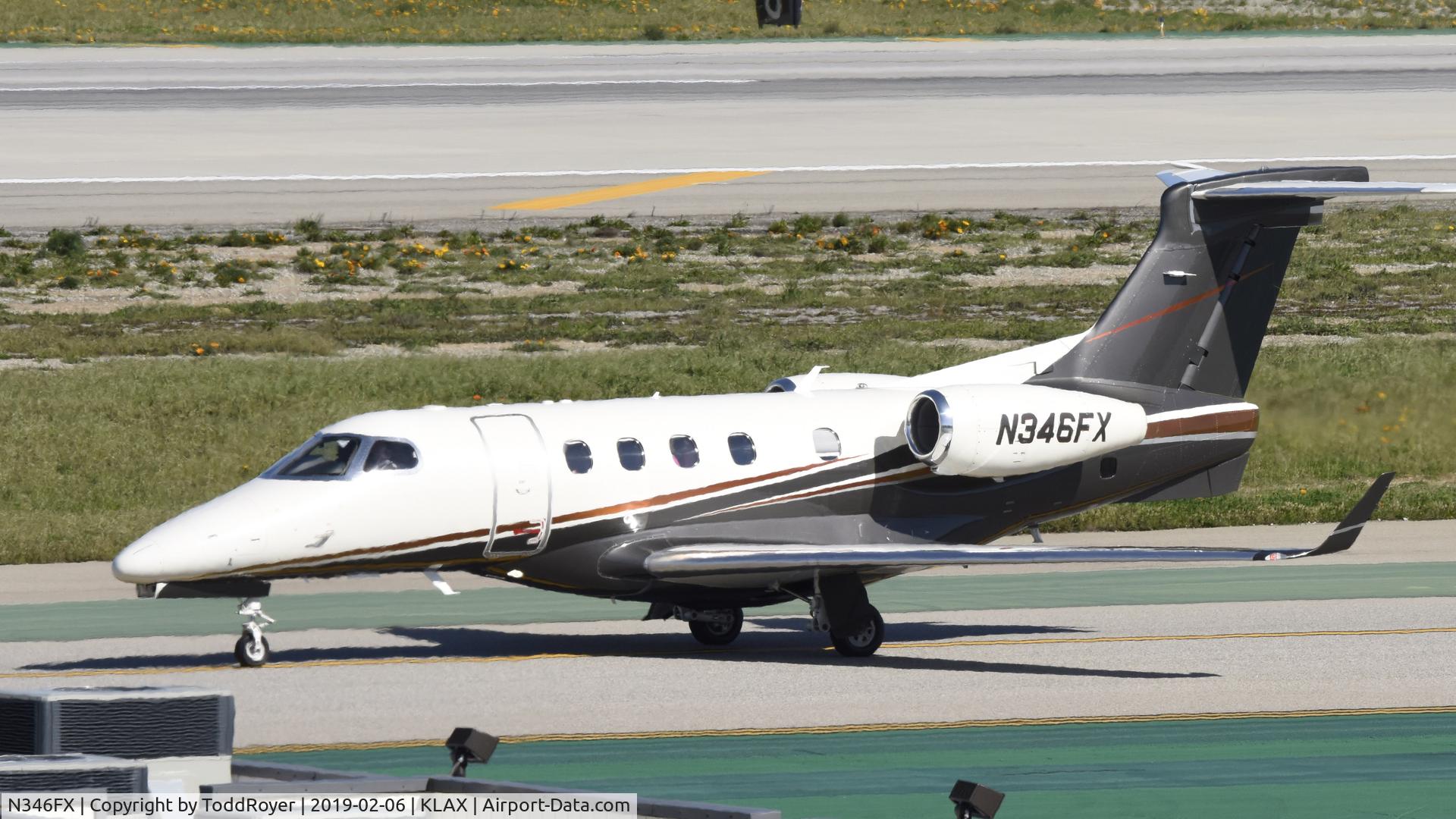 N346FX, 2012 Embraer EMB-505 Phenom 300 C/N 50500090, Taxiing for departure at LAX