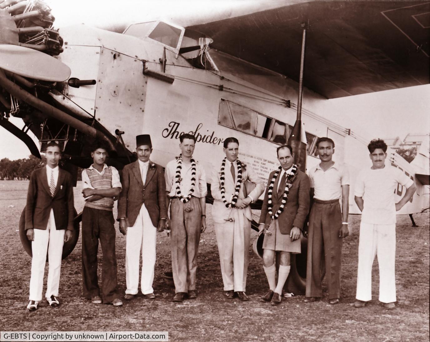 G-EBTS, 1927 Fokker F-VIIA C/N 4953, The Spider with crew in India in the aircraft's later years in India. My father is 4th from the left one of 3 with garlands around his neck
