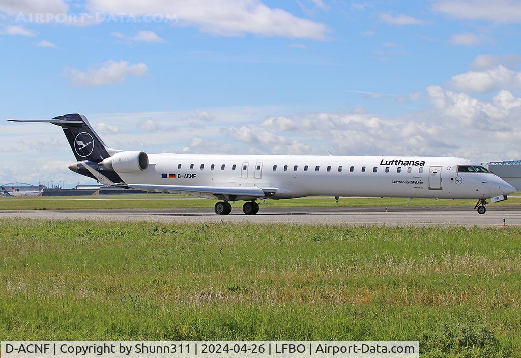 D-ACNF, 2009 Bombardier CRJ-900 (CL-600-2D24) C/N 15243, Taxiing holding point rwy 14L For departure... New Lufthansa c/s