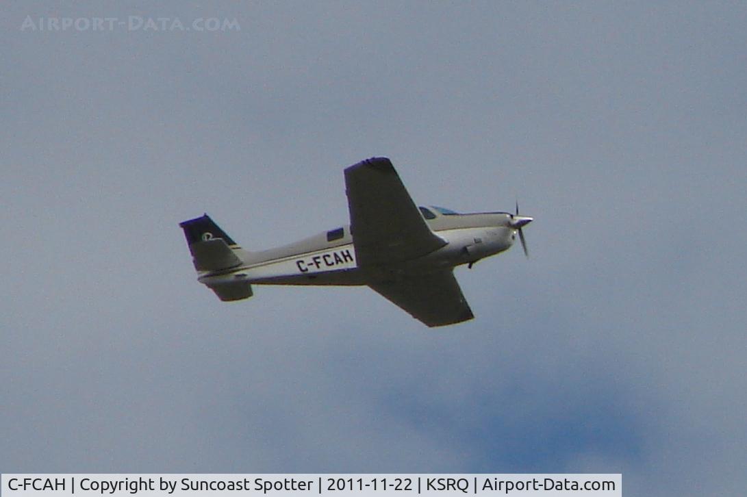 C-FCAH, 1968 Beech 36 Bonanza C/N E-13, Beechcraft Bonanza 36 departs Runway 14 at Sarasota-Bradenton International Airport