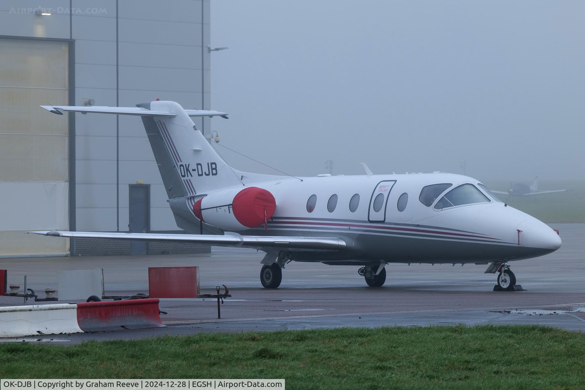 OK-DJB, 2004 Raytheon Beechjet 400A C/N RK-376, Parked at Norwich in the fog.