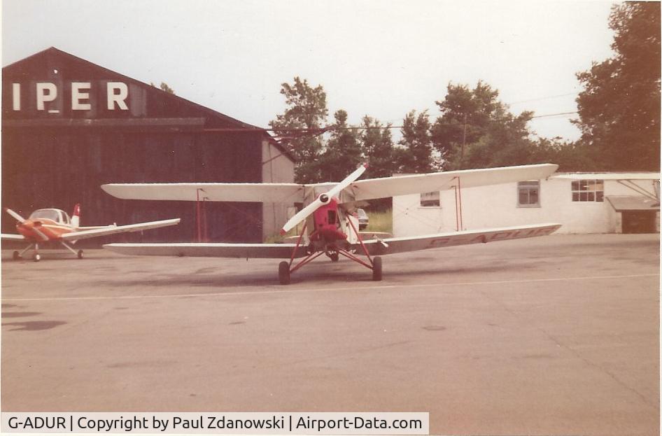 G-ADUR, 1936 De Havilland DH.87B Hornet Moth C/N 8085, I took this 'photo at Elstree in about 1971 I was very fortunate in being given a ride in it. I was taking my PPL ground exams at the time and had passed my GHT on a Tiger Moth G-ANEF