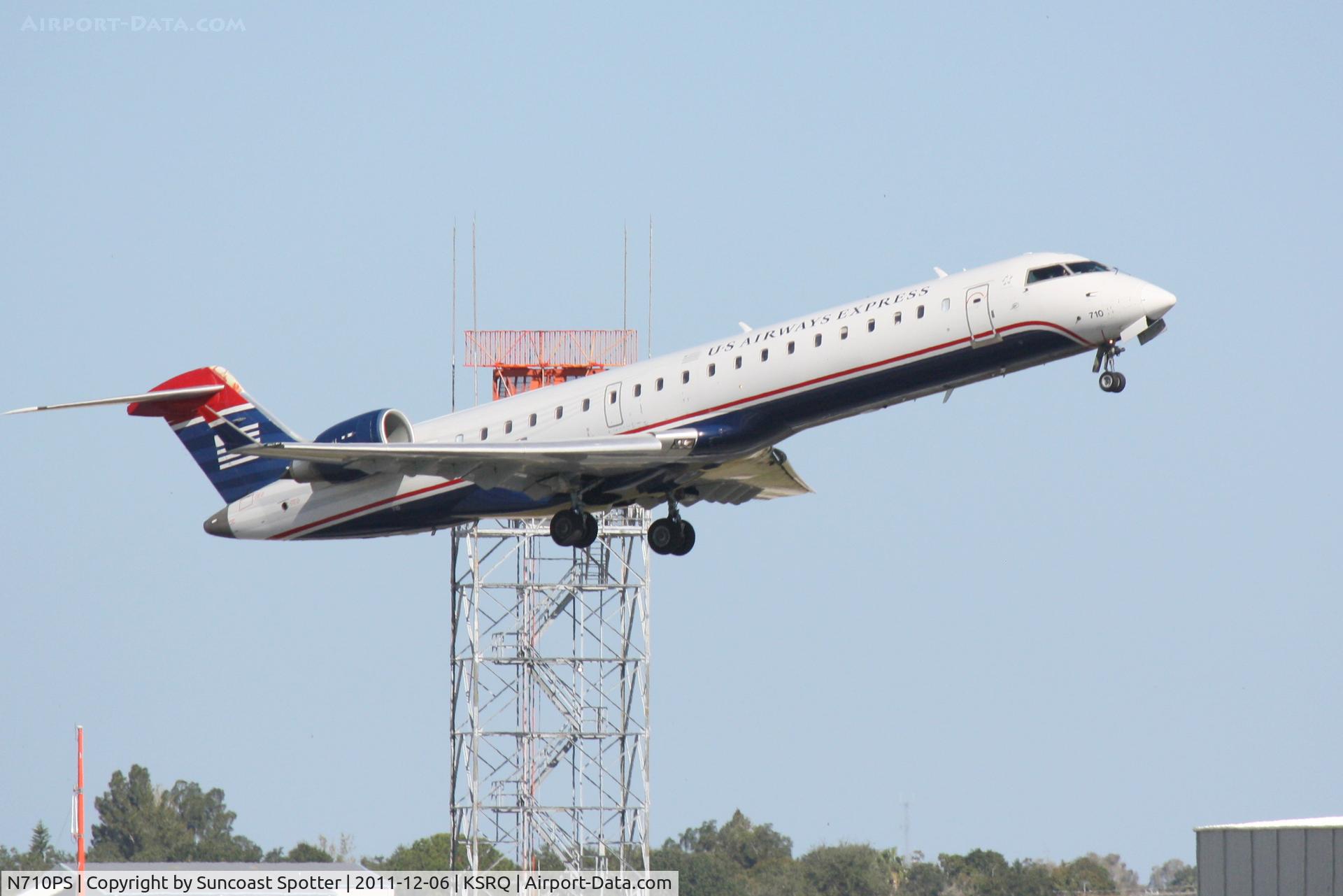 N710PS, 2004 Bombardier CRJ-701 (CL-600-2C10) Regional Jet C/N 10167, PSA Airlines/ US Airways Express Canadair Regional Jet CRJ-700 N710PS on departure from Runway 14 at Sarasota-Bradenton International Airport