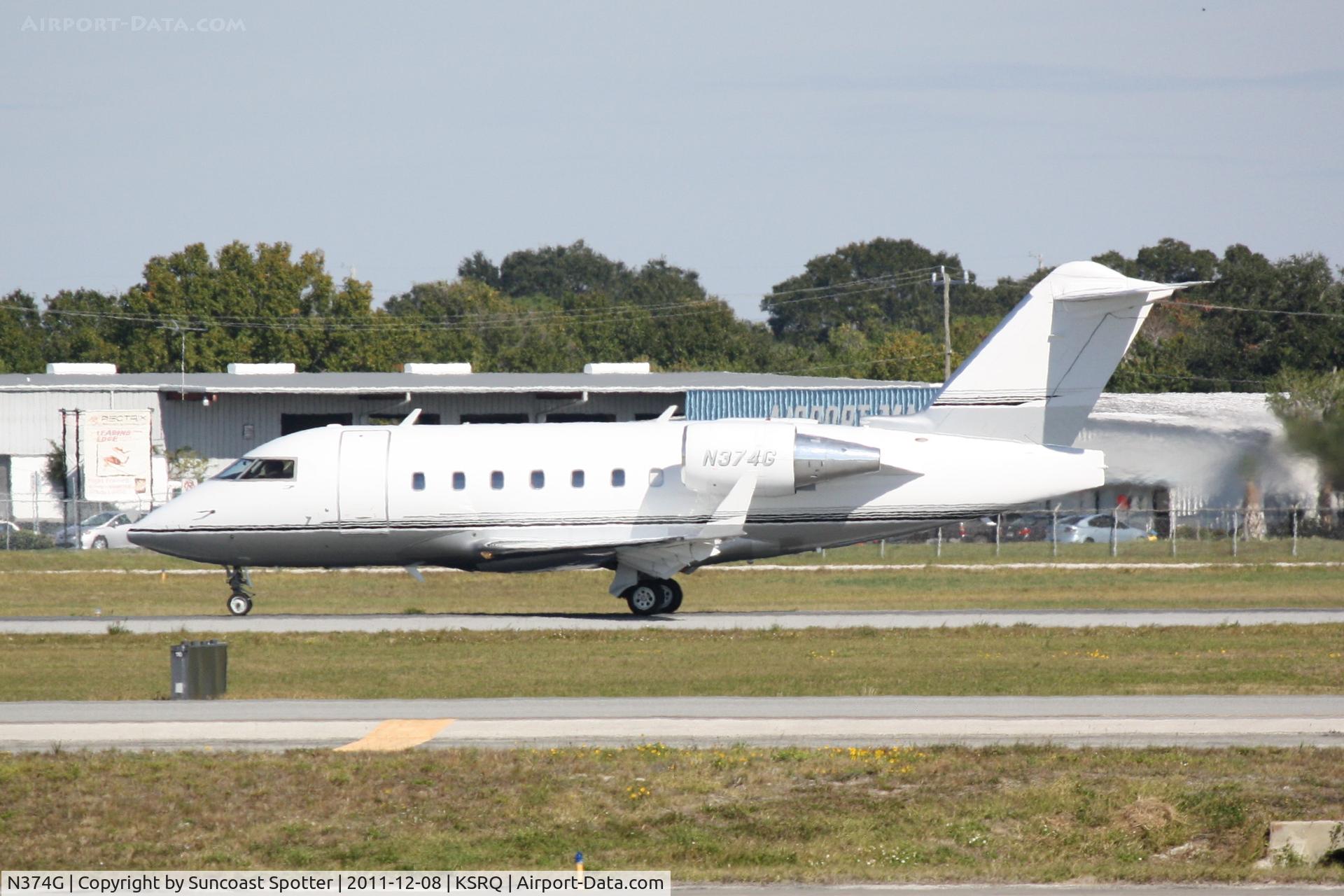 N374G, 2000 Canadair Challenger 604 (CL-600-2B16) C/N 5368, Canadair Challenger 604 departs Runway 32 at Sarasota-Bradenton International Airport