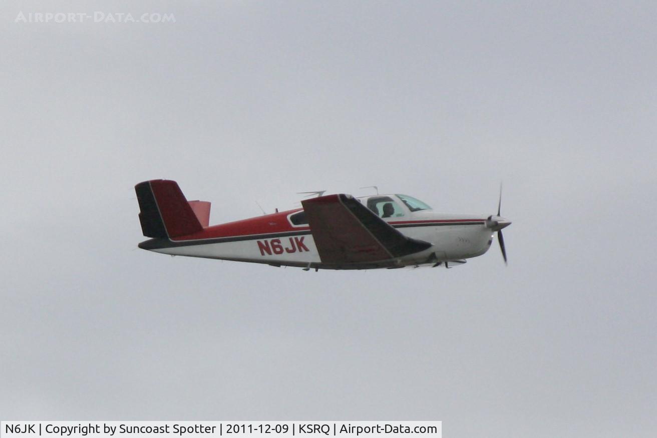 N6JK, 1964 Beech S35 Bonanza C/N D-7577, Beech S35 departs Runway 14 at Sarasota-Bradenton International Airport