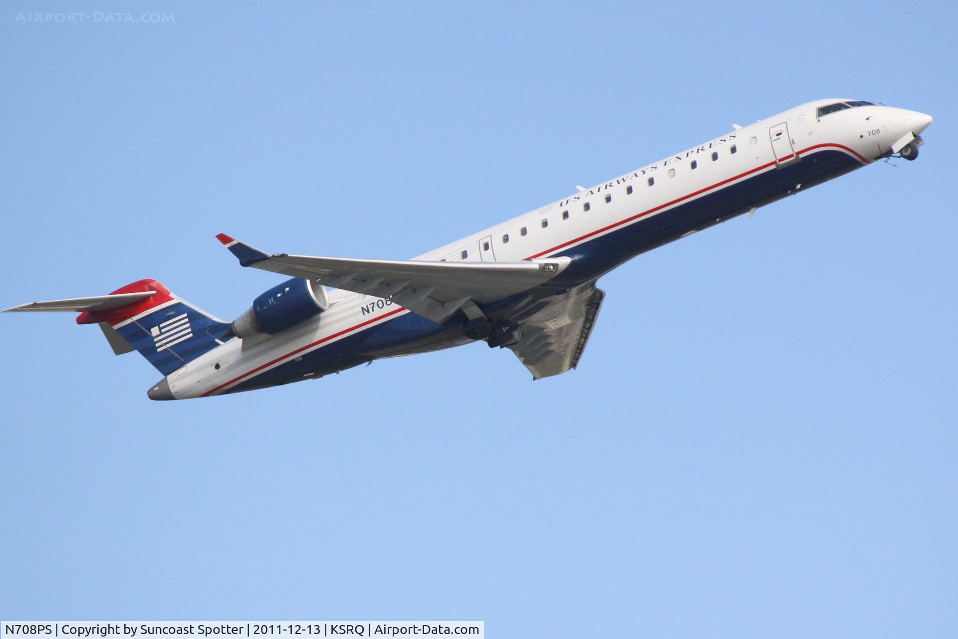 N708PS, 2004 Bombardier CRJ-701 (CL-600-2C10) Regional Jet C/N 10160, PSA Airlines/US Airways Express CRJ-700 departs from Runway 14 at Sarasota Bradenton International Airport