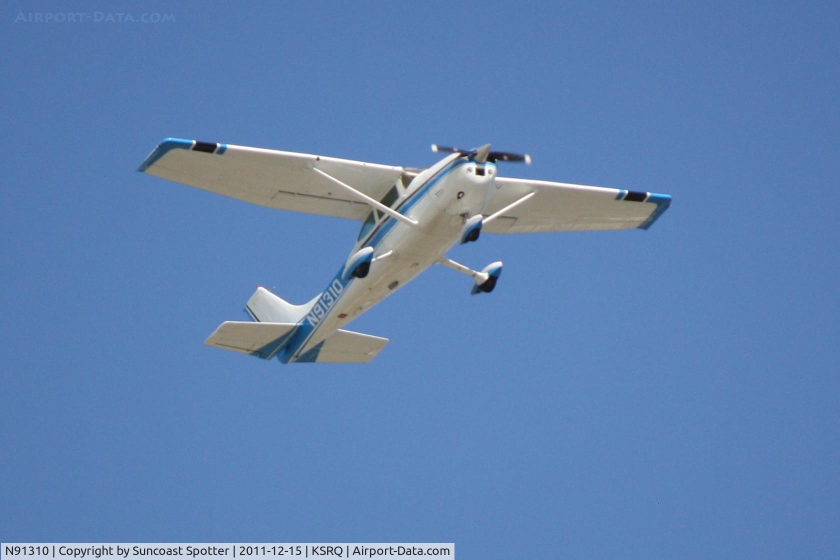 N91310, 1973 Cessna 182P Skylane C/N 18261988, N91310 flies over Sarasota-Bradenton International Airport