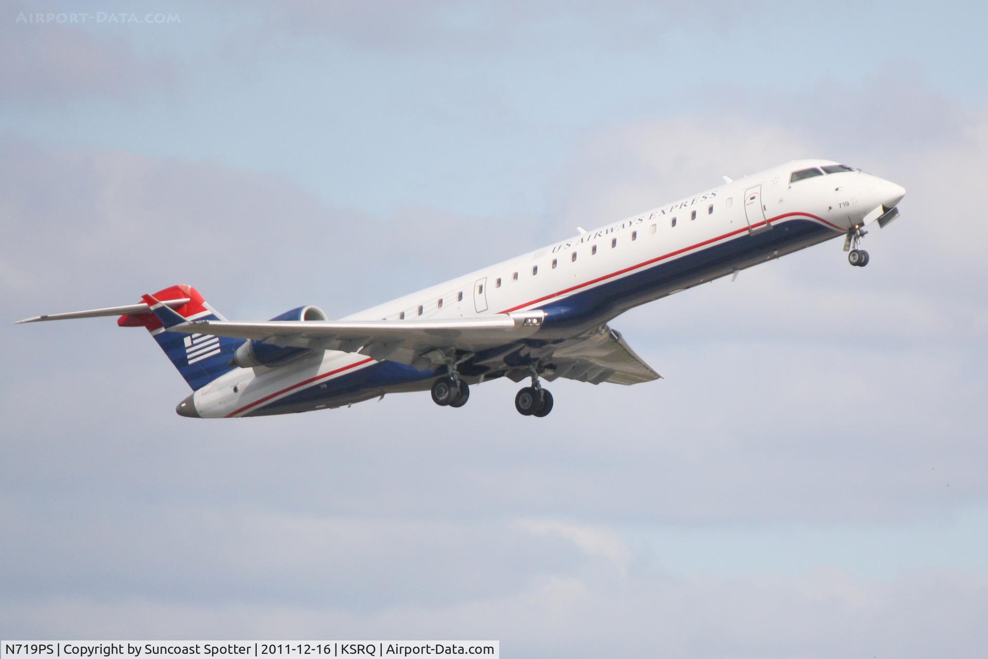 N719PS, 2004 Bombardier CRJ-701 (CL-600-2C10) Regional Jet C/N 10177, PSA Airlines/US Airways Express CRJ-700 departs from Runway 14 at Sarasota-Bradenton International Airport enroute to Charlotte/Douglas International Airport