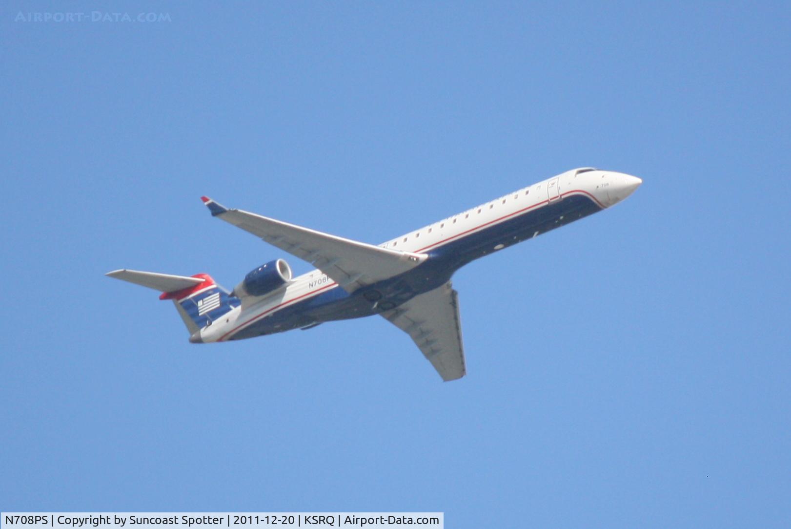 N708PS, 2004 Bombardier CRJ-701 (CL-600-2C10) Regional Jet C/N 10160, PSA Flight 2232 departs Runway 14 at Sarasota-Bradenton International Airport enroute to Charlotte/Douglas International Airport