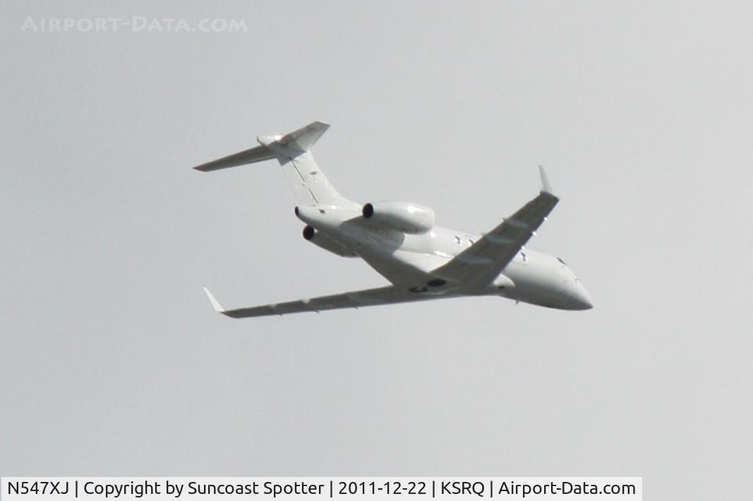 N547XJ, 2009 Bombardier Challenger 300 (BD-100-1A10) C/N 20281, N547XJ departs Runway 14 at Sarasota-Bradenton International Airport enroute to Westchester County Airport