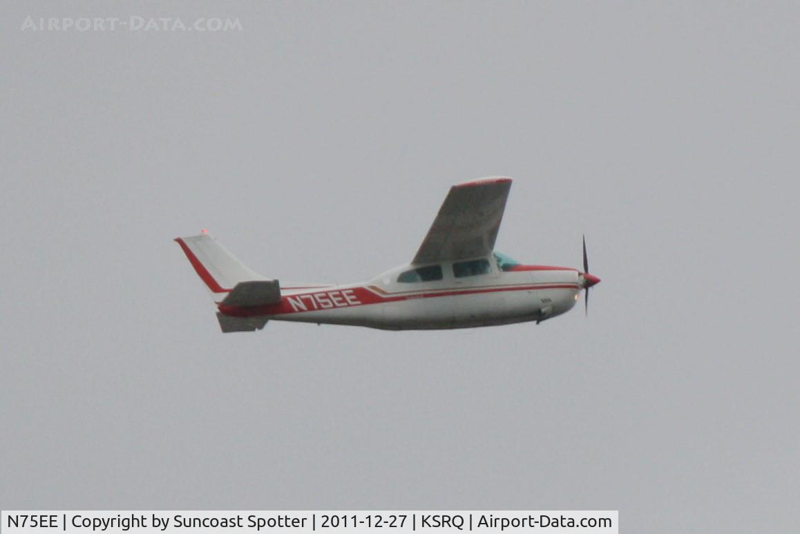 N75EE, 1975 Cessna 210L Centurion C/N 21060837, N75EE departs Runway 14 at Sarasota-Bradenton International Airport enroute to Exuma International Airport