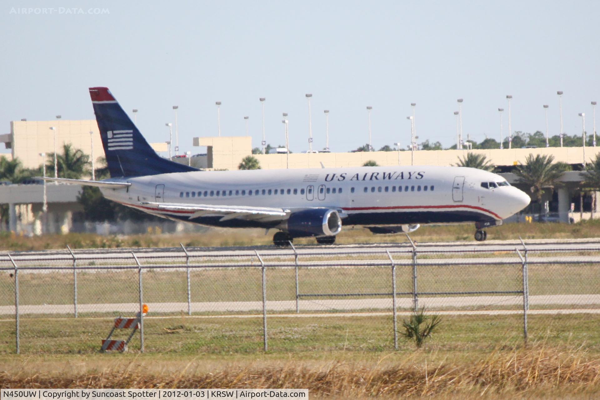 N450UW, 1990 Boeing 737-4B7 C/N 24933, US Airways Flight 910 taxis for departure at Southwest Florida International Airport prior to a flight to Charlotte/Douglas International Airport