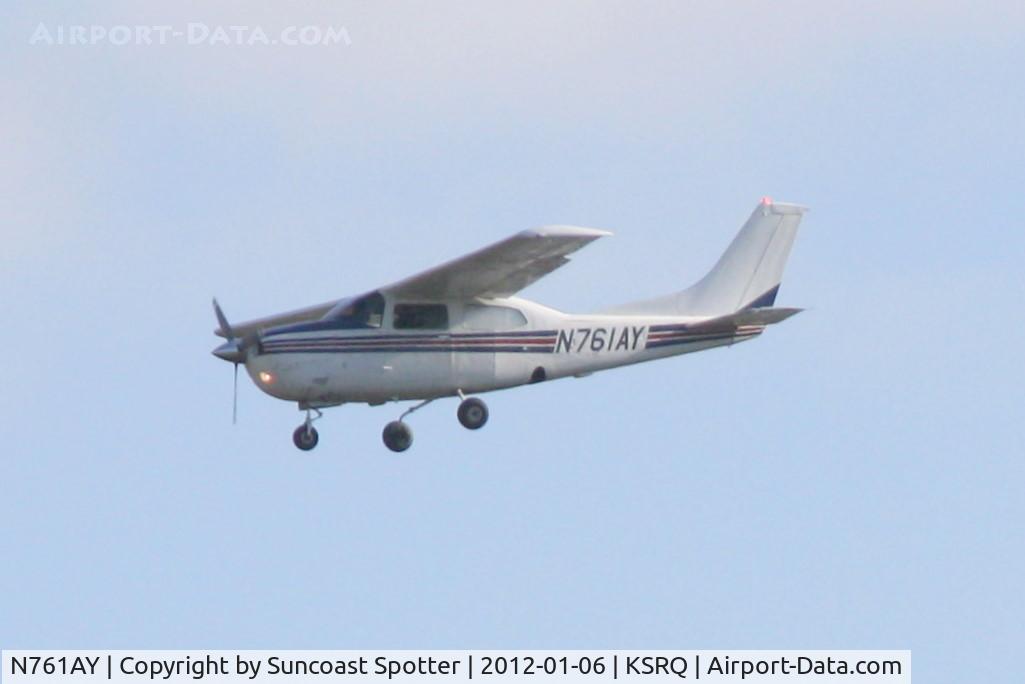 N761AY, 1977 Cessna 210M Centurion C/N 21062113, Flight Express Flight 404 on approach to Runway 32 at Sarasota-Bradenton International Airport following a flight from Opa-Locka Executive Airport