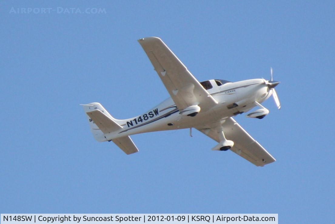N148SW, 2004 Cirrus SR22 C/N 0987, N148SW departs Runway 14 at Sarasota-Bradenton International Airport enroute to Tallahassee Regional Airport