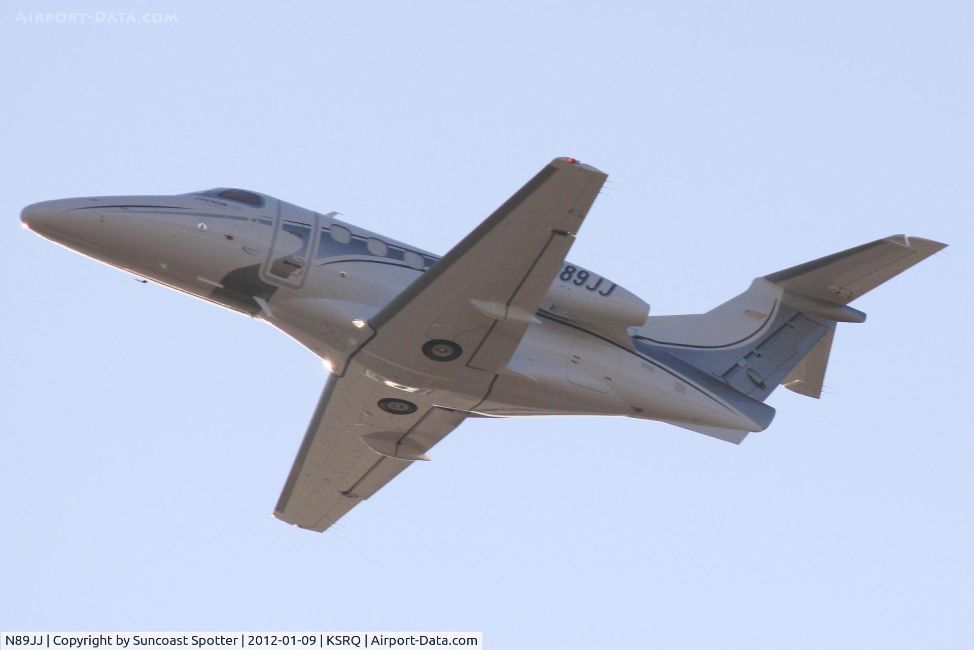 N89JJ, 2010 Embraer EMB-500 Phenom 100 C/N 50000150, N89JJ departs Runway 14 at Sarasota-Bradenton International Airport enroute to New Orleans International Airport