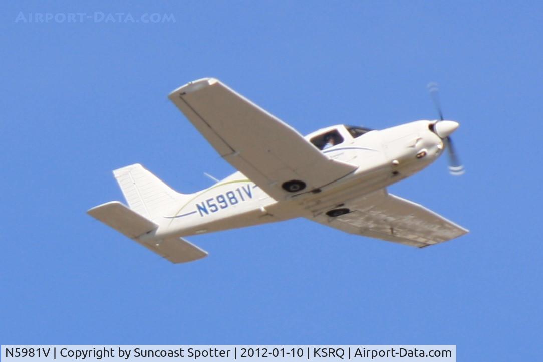 N5981V, 1977 Piper PA-28R-201 Cherokee Arrow III C/N 28R-7737078, N5981V departs Runway 14 at Sarasota-Bradenton International Airport enroute to Vero Beach Municipal Airport