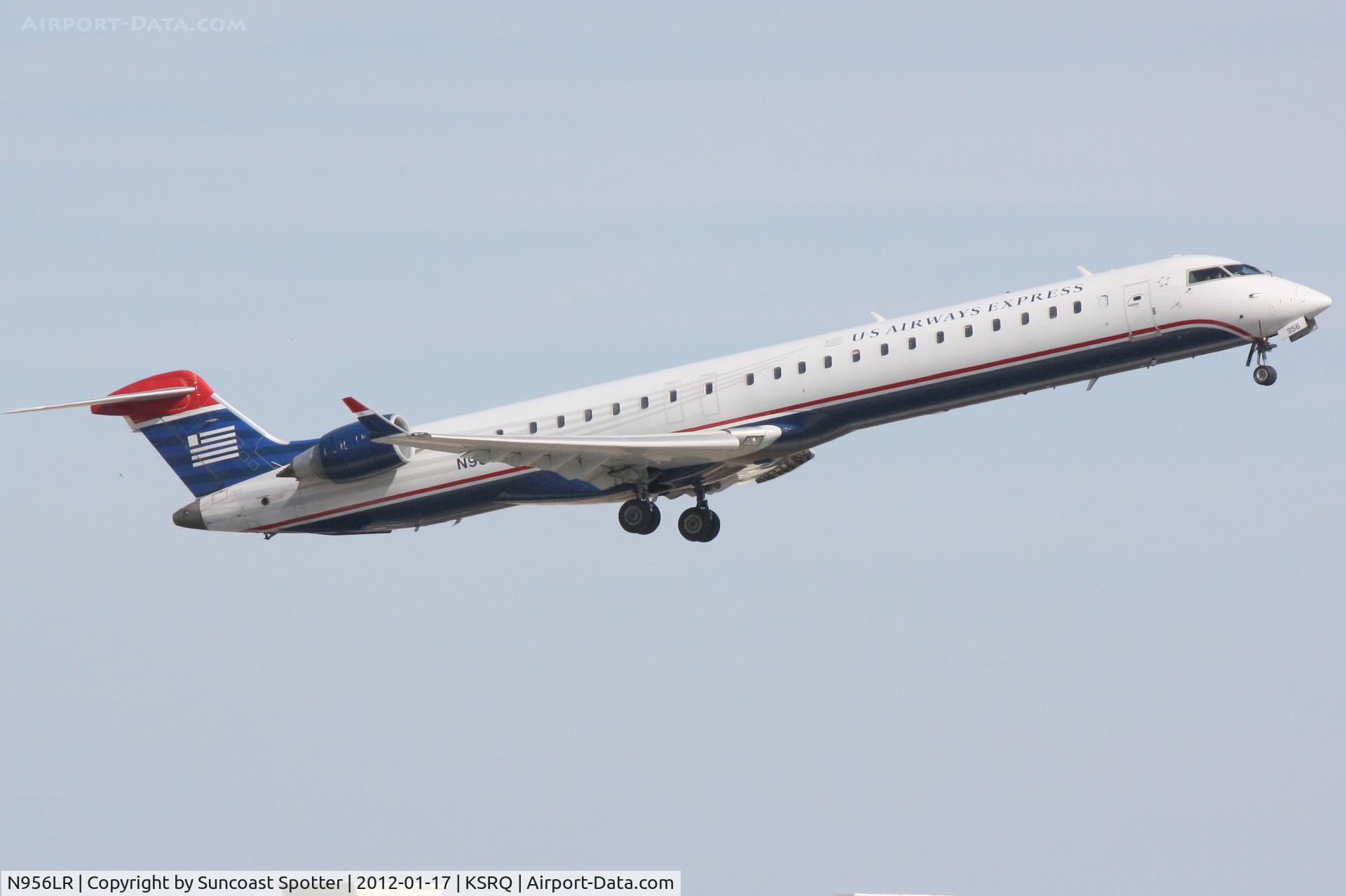 N956LR, 2005 Bombardier CRJ-900ER (CL-600-2D24) C/N 15056, Mesa Airlines/US Airways Express Flight 2647 departs Runway 14 at Sarasota-Bradenton International Airport enroute to Charlotte/Douglas International Airport