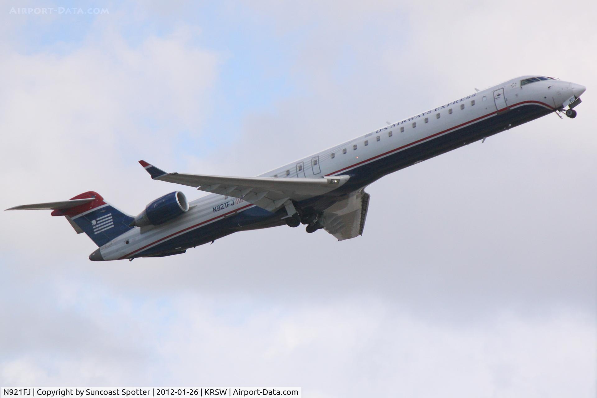 N921FJ, 2004 Bombardier CRJ-900ER (CL-600-2D24) C/N 15021, Mesa Airlines/US Airways Express Flight 2647 departs Runway 14 at Sarasota-Bradenton International Airport enroute to Charlotte/Douglas International Airport