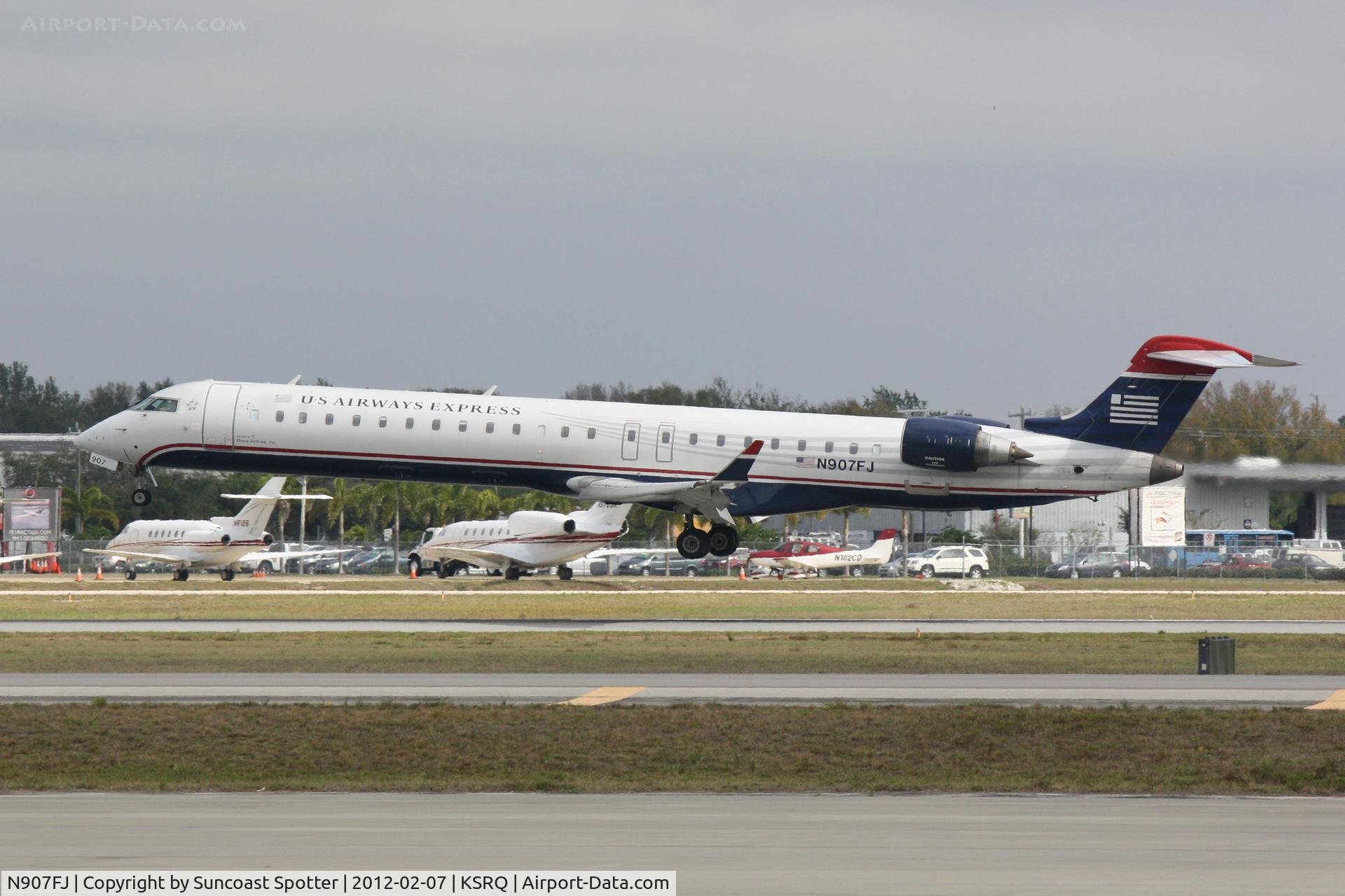 N907FJ, 2003 Bombardier CRJ-900ER (CL-600-2D24) C/N 15007, Mesa/US Airways Flight 2607 arrives on Runway 32 at Sarasota-Bradenton International Airport following a flight from Charlotte-Douglas International Airport