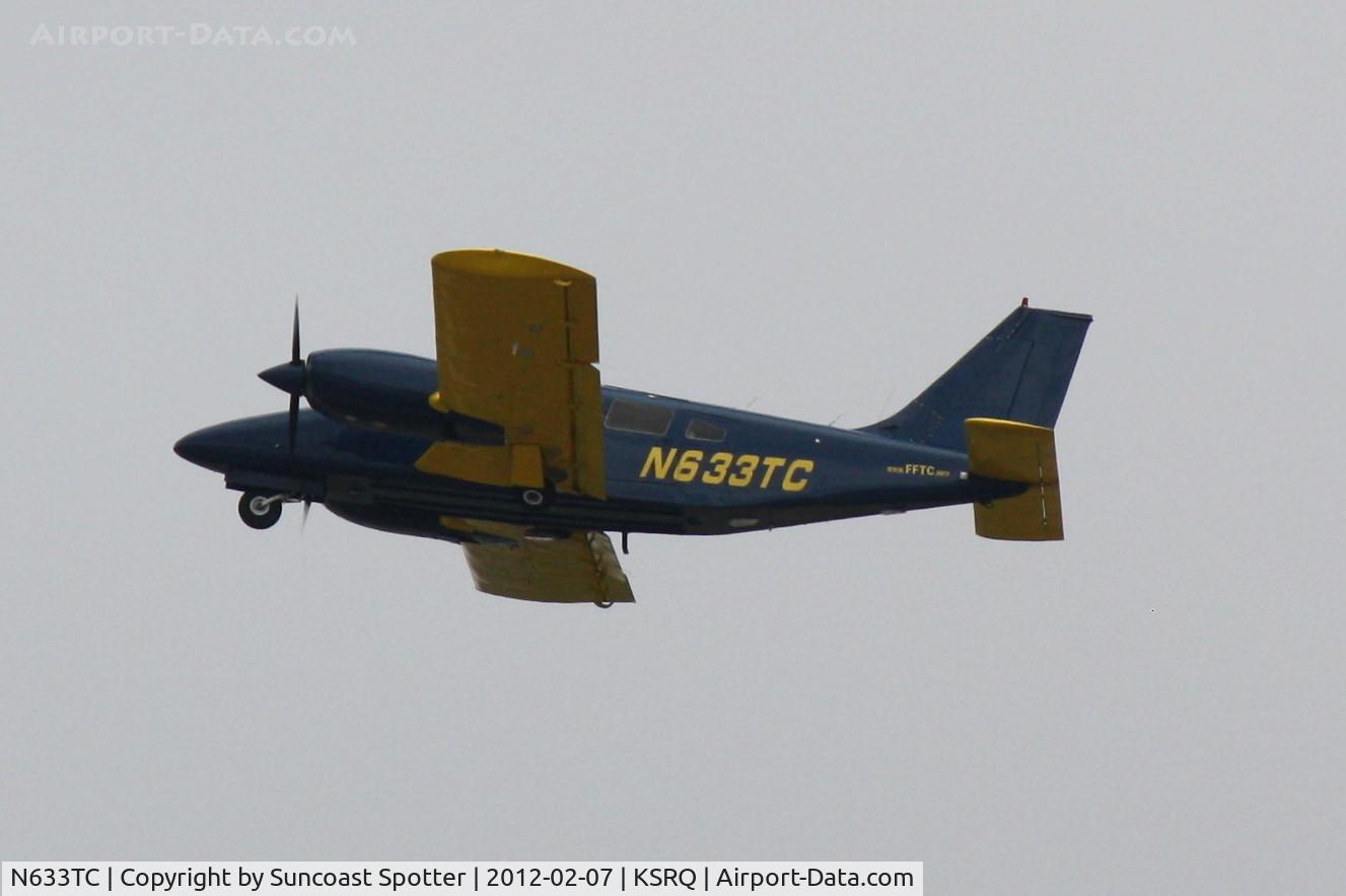 N633TC, 1978 Piper PA-34-200T C/N 34-7870328, N633TC flies over Sarasota-Bradenton International Airport