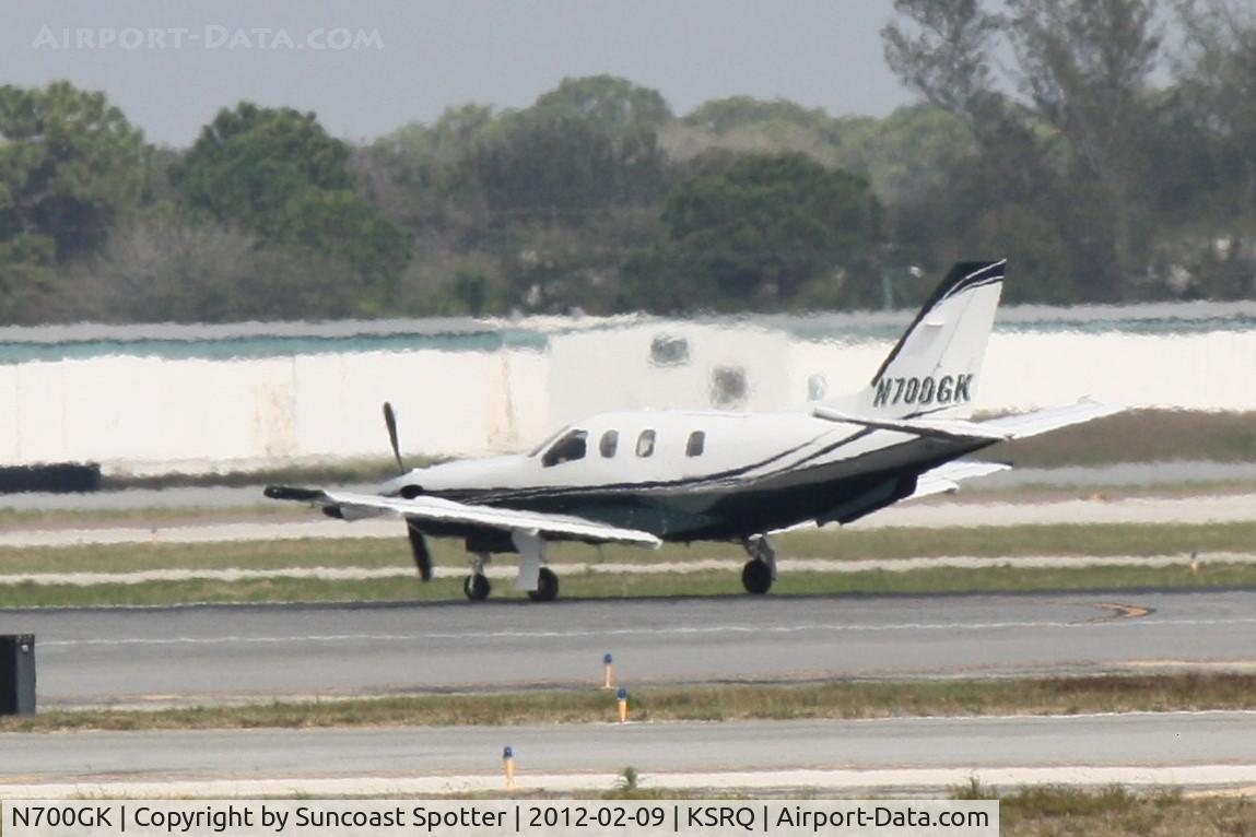N700GK, 2005 Socata TBM-700 C/N 320, N700GK departs Runway 32 at Sarasota-Bradenton International Airport enroute to Fort Smith Regional Airport