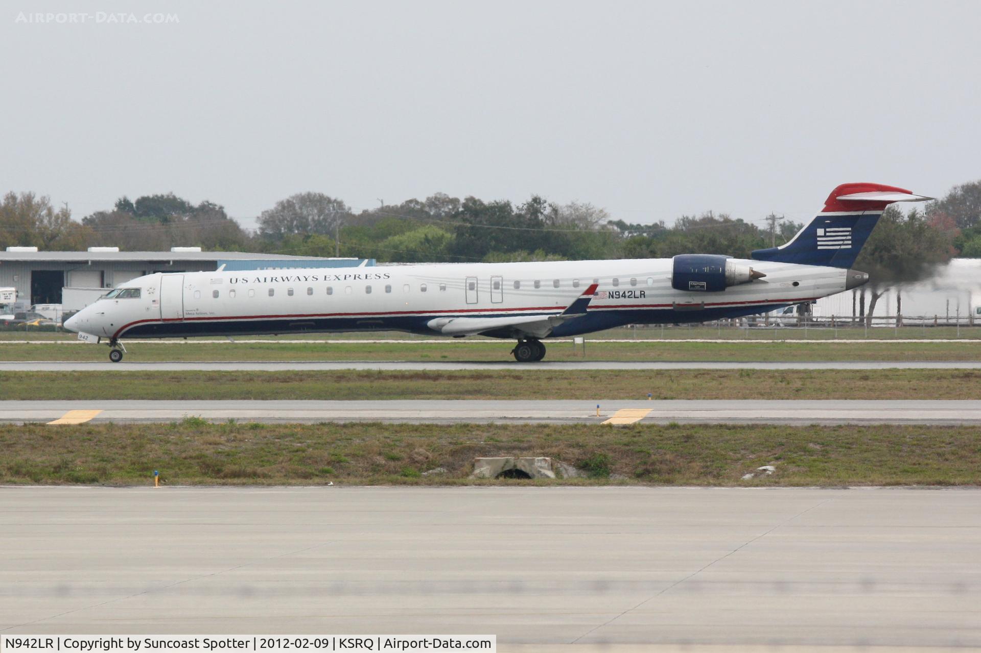 N942LR, 2005 Bombardier CRJ-900ER (CL-600-2D24) C/N 15042, Mesa/US Air Flight 2647 departs Runway 32 at Sarasota-Bradenton International Airport enroute to Charlotte/Douglas International Airport