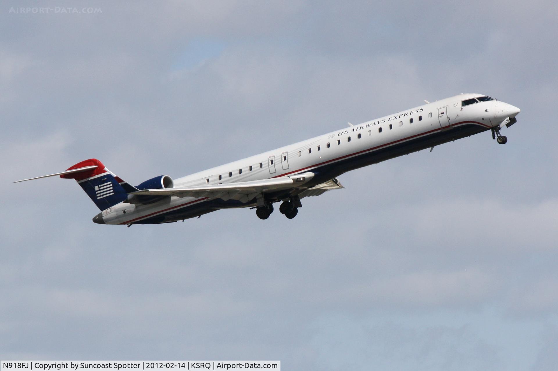 N918FJ, 2004 Bombardier CRJ-900ER (CL-600-2D24) C/N 15018, Mesa/US Air Flight 2647 departs Runway 14 at Sarasota-Bradenton International Airport enroute to Charlotte-Douglas International Airport
