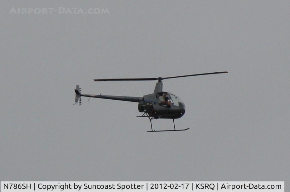 N786SH, 2004 Robinson R22 C/N 3626, N786SH flies over Sarasota-Bradenton International Airport