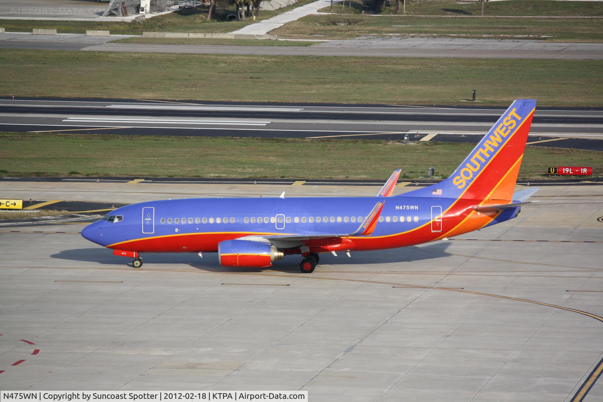 N475WN, 2004 Boeing 737-7H4 C/N 32474, Southwest Flight 1186 arrives on Runway 19L at Tampa International Airport following a flight from Manchester Airport
