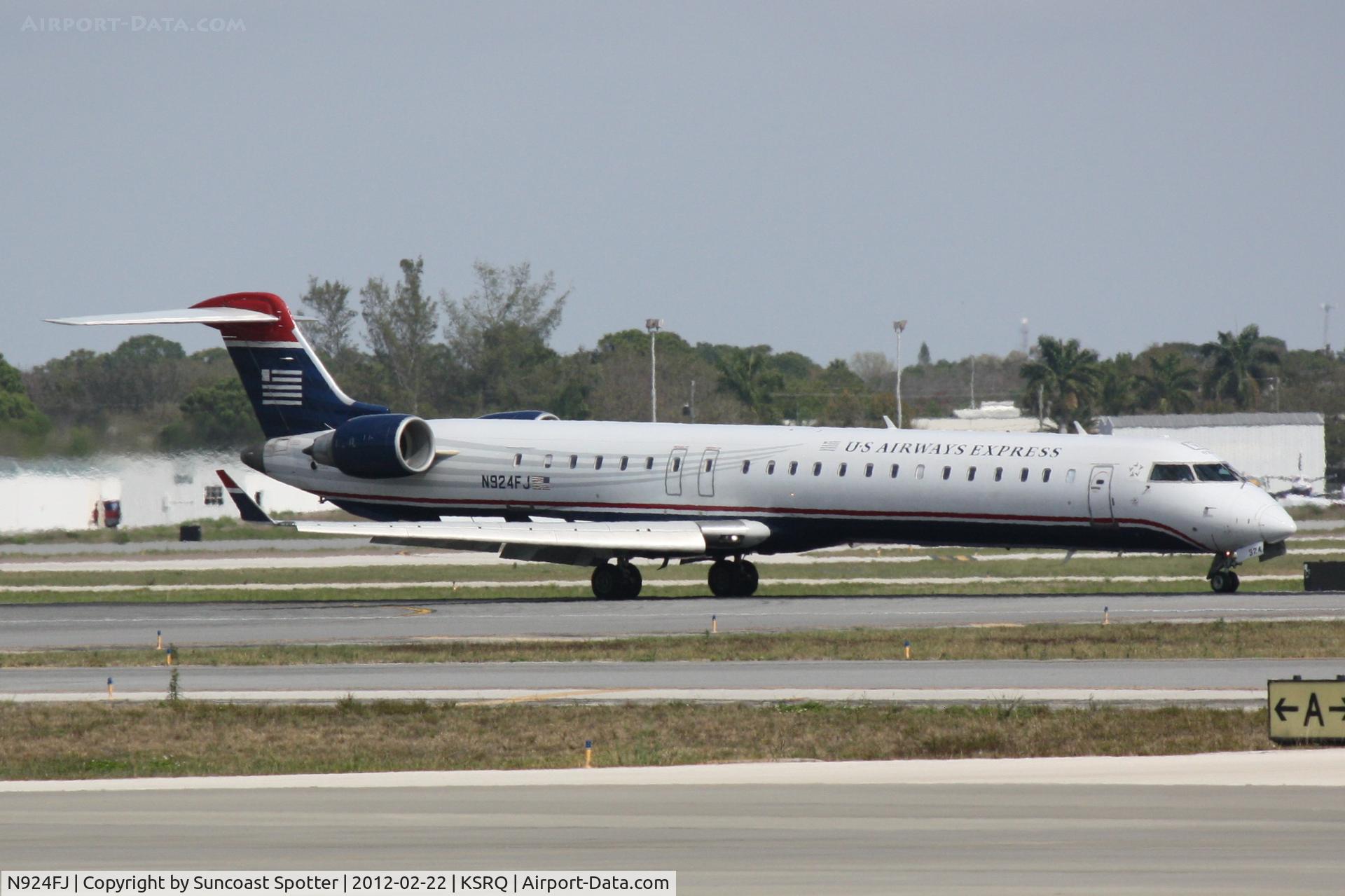 N924FJ, 2004 Bombardier CRJ-900ER (CL-600-2D24) C/N 15024, Mesa/US Flight 2607 arrives on Runway 14 at Sarasota-Bradenton International Airport following a flight from Charlotte/Douglas International Airport
