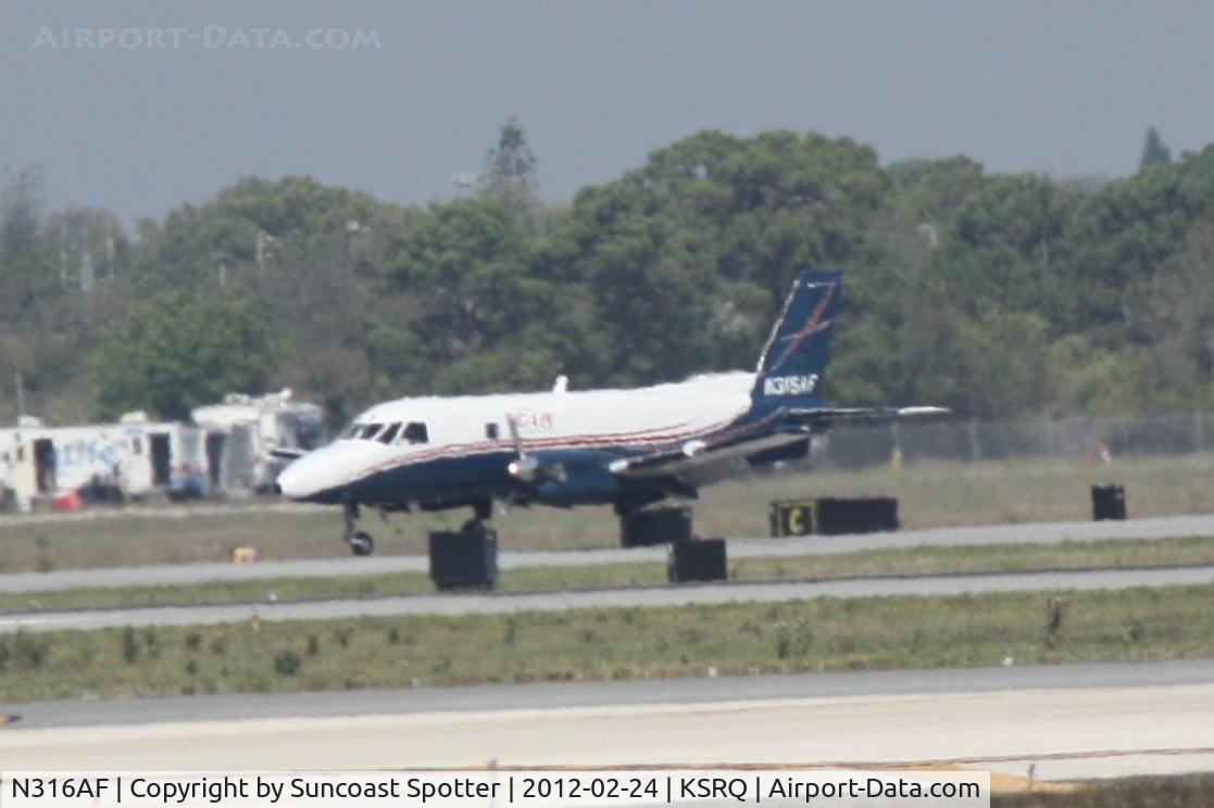 N316AF, 1980 Embraer EMB-110P1 Bandeirante C/N 110.271, Agape E110 lands at SRQ