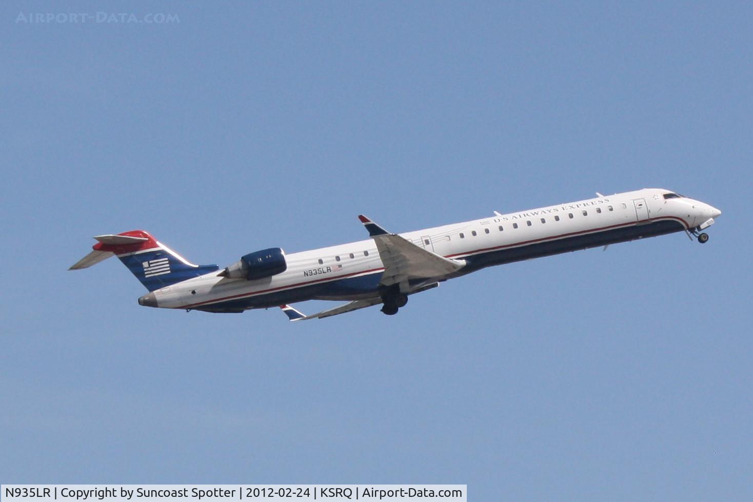 N935LR, 2005 Bombardier CRJ-900ER (CL-600-2D24) C/N 15035, Mesa/US Air Flight 2647 departs Runway 14 at Sarasota-Bradenton International Airport enroute to Charlotte/Douglas International Airport