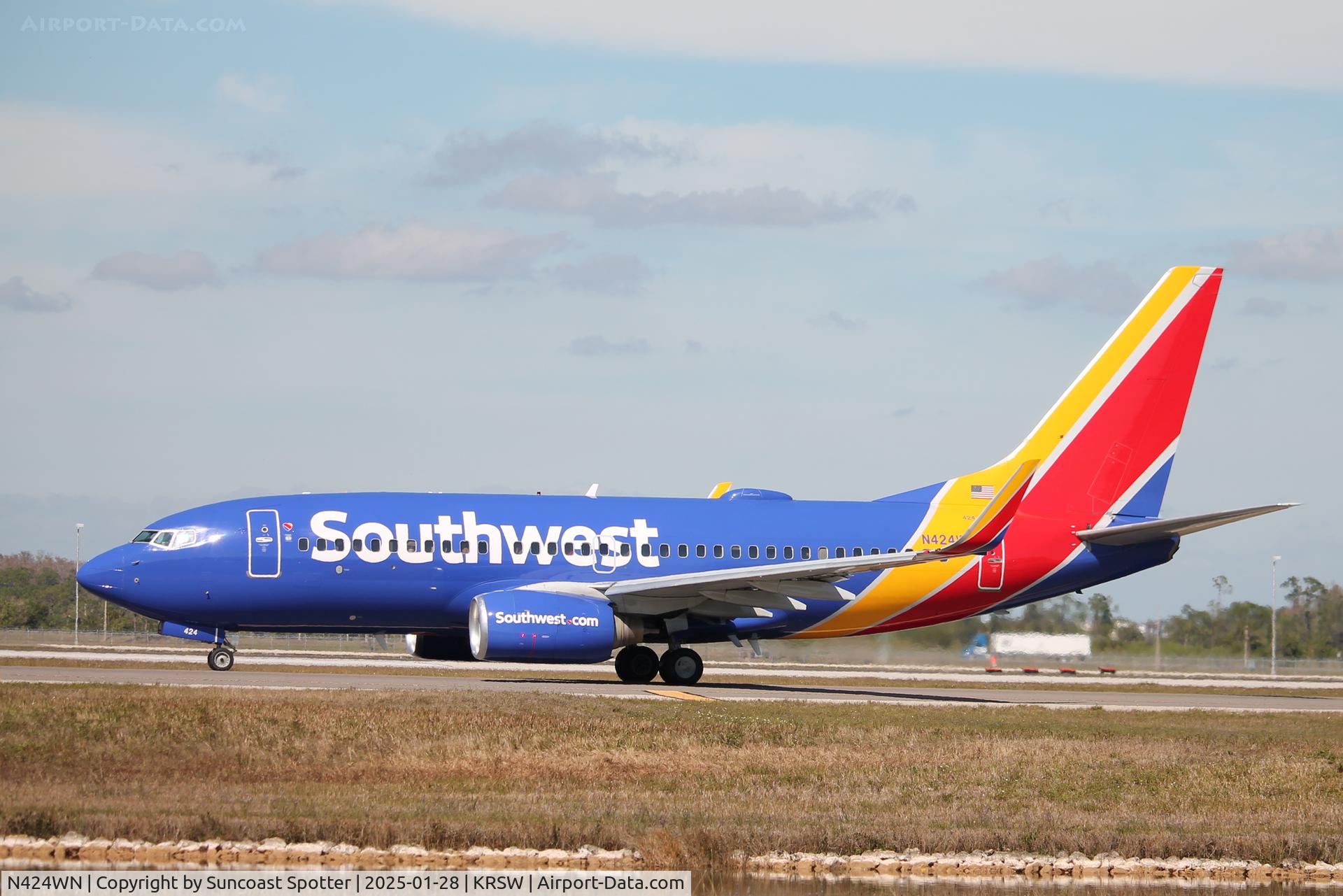 N424WN, 2002 Boeing 737-7H4 C/N 29828, Southwest Flight 2459 taxis at Southwest Florida International Airport prior to flight to St Louis-Lambert International Airport
