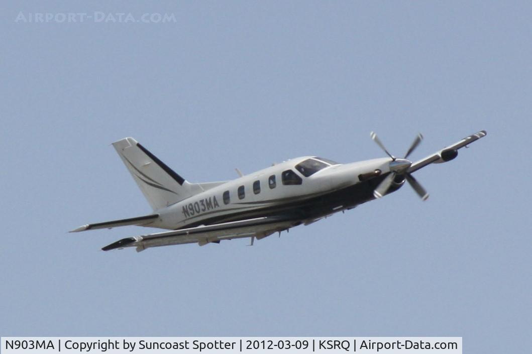 N903MA, 2004 Socata TBM-700 C/N 308, N903MA departs Runway 14 at Sarasota-Bradenton International Airport enroute to Fernandina Beach Municipal Airport