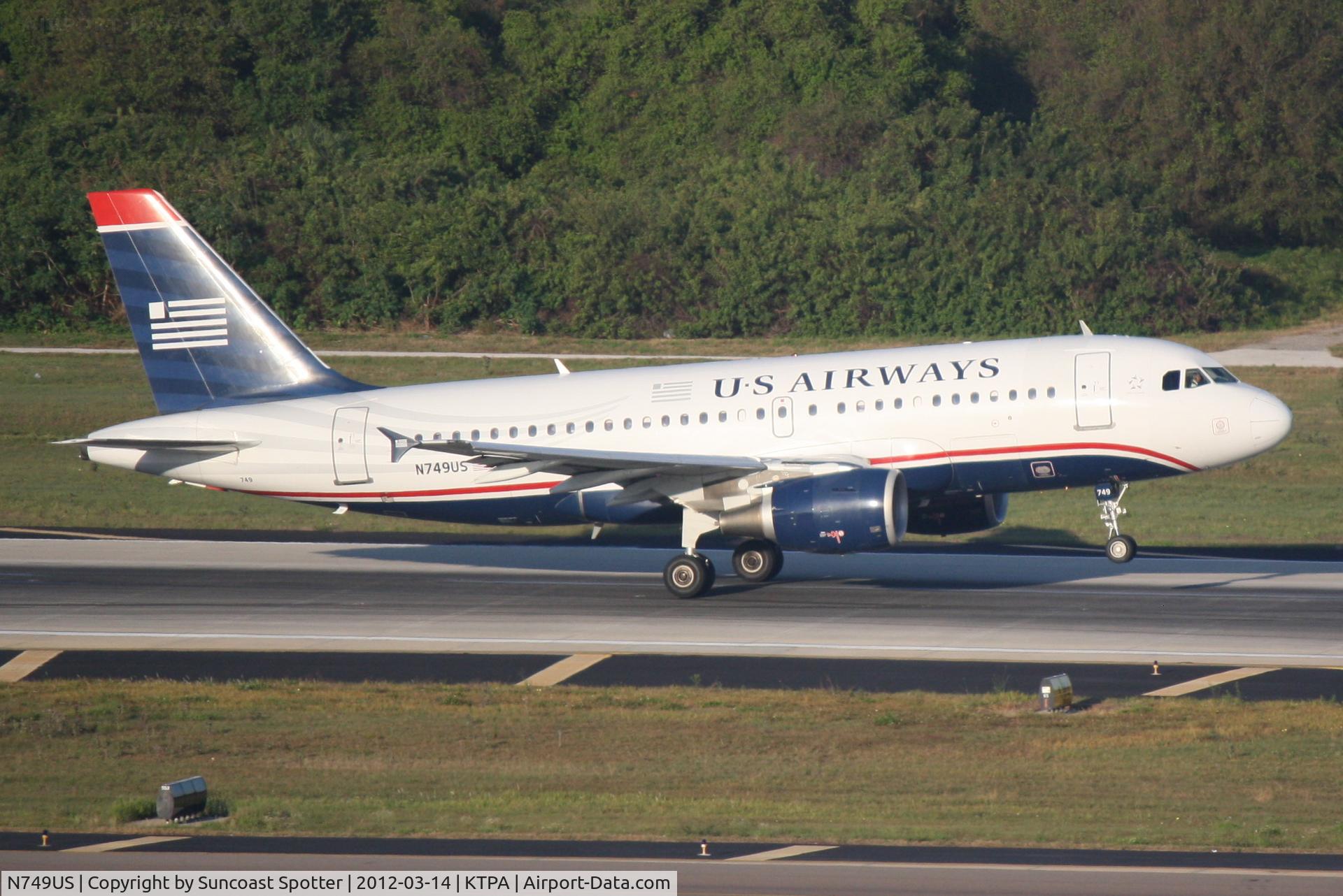 N749US, 2000 Airbus A319-112 C/N 1313, US Air Flight 1680 departs Runway 1L at Tampa International Airport enroute to Regan National Airport