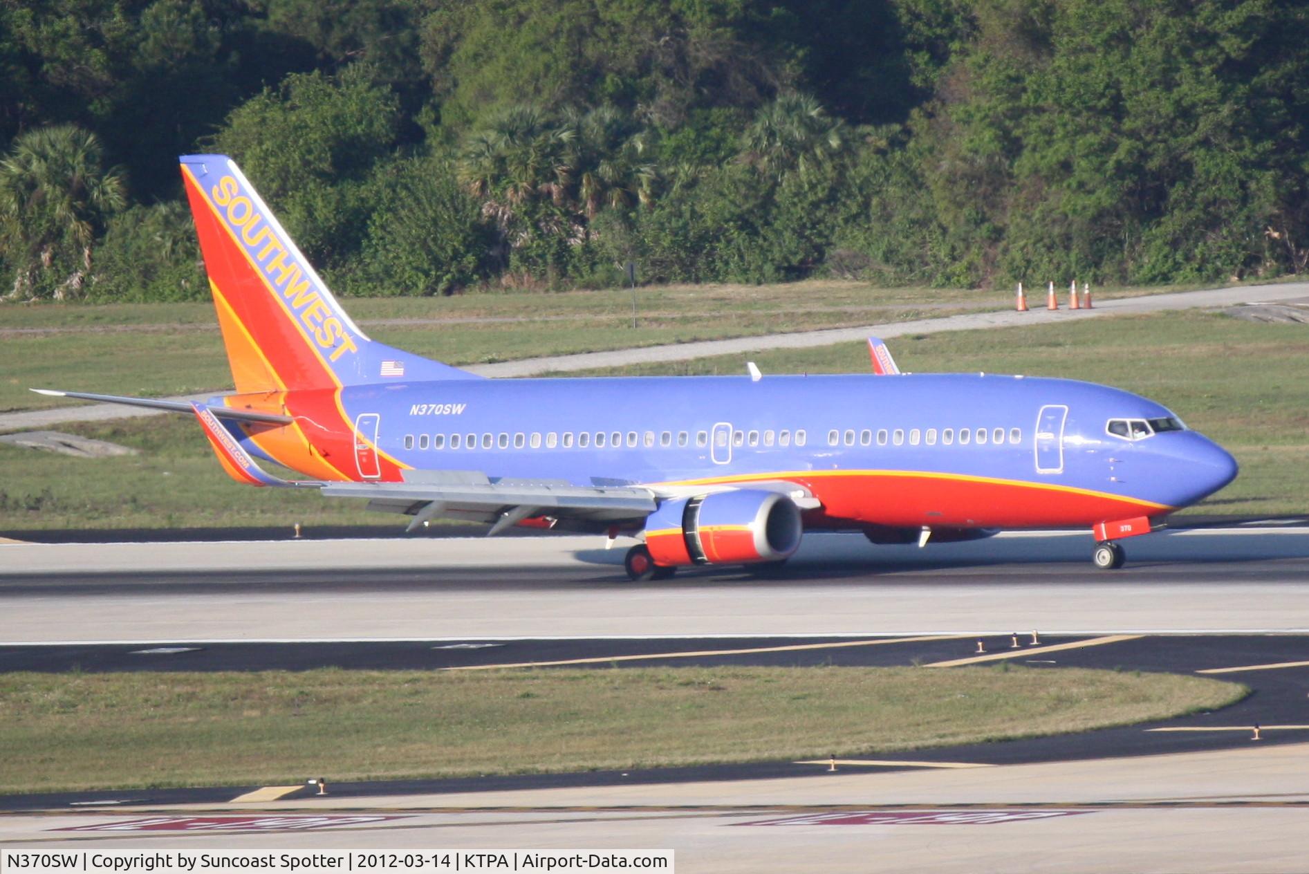 N370SW, 1993 Boeing 737-3H4 C/N 26597, Southwest Flight 2059 arrives on Runway 1L at Tampa International Airport following a flight from Louisville International Airport