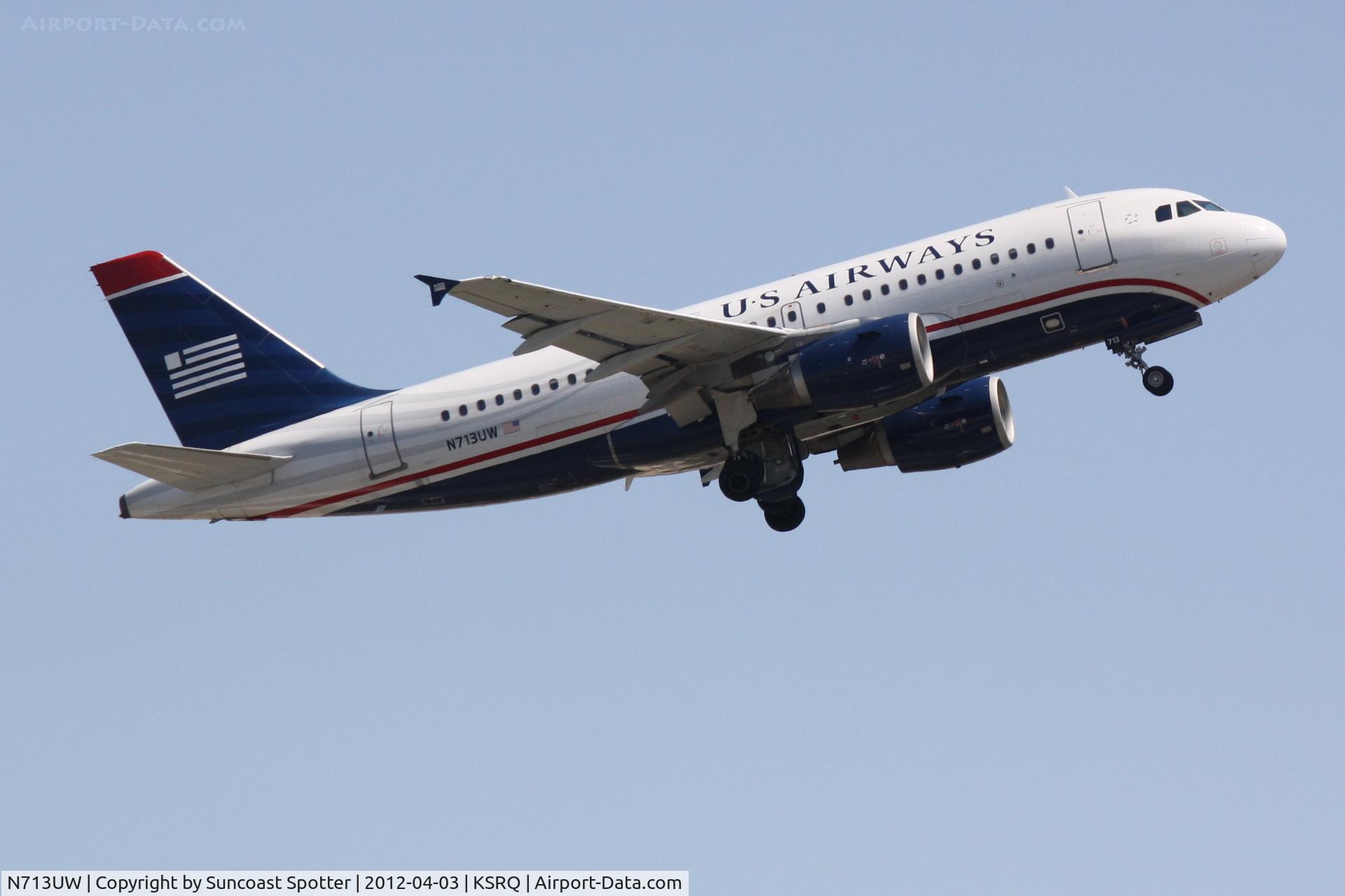 N713UW, 1999 Airbus A319-112 C/N 1040, US Air Flight 1860 departs Runway 14 at Sarasota-Bradenton International Airport enroute to Charlotte-Douglas International Airport
